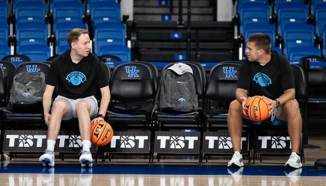 Zach and Matt in Eberlein Drive shirts courtside with basketballs